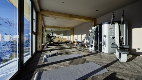A modern fitness room with large windows and a view of the mountains. There are various training machines and mats on the floor. - Alpenhotel Laurin - Hochgurgl
