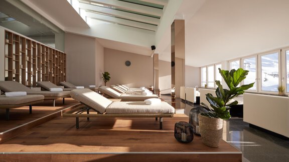 Ein moderner Wellnessbereich mit Liegen aus Holz und großen Fenstern. Die helle und einladende Atmosphäre schafft einen entspannenden Raum. - TOP Hotel Hochgurgl - Hochgurgl
