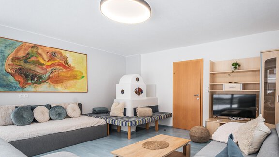 Wohnzimmer mit Ofen - APART Naturcamping Kuprian - Huben