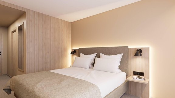 Ein modernes Schlafzimmer mit einem Doppelbett und sanften Farben. Die Wände sind hell und die Beleuchtung schafft eine gemütliche Atmosphäre. - Hotel Marko - Oetz