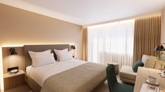 Ein modernes Hotelzimmer mit einem großen Bett und sanften Farbtönen. Es gibt eine gemütliche Sitzecke und viel Tageslicht durch die Fenster. - Hotel Marko - Oetz
