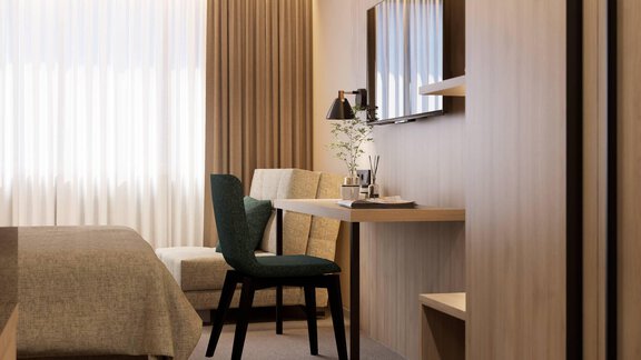 Ein modernes Zimmer mit einem gemütlichen Bett und einem Arbeitsbereich. Große Fenster lassen viel Tageslicht herein und schaffen eine helle Atmosphäre. - Hotel Marko - Oetz