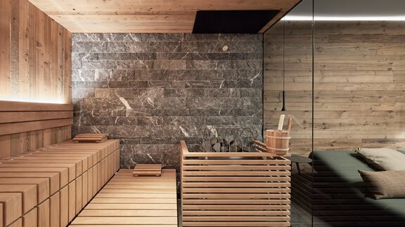 A modern and stylish spa with wood and stone elements. The sauna is minimally designed and radiates a relaxing atmosphere. - Chalet White Pearl by MYALPS - Sölden
