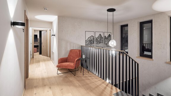 A modern hallway with a spotlighted wooden floor and an elegant staircase. A red armchair and artworks on the wall add style to the space. - Chalet White Pearl by MYALPS - Sölden