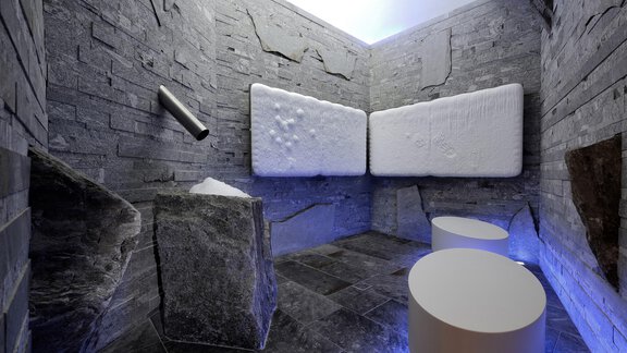 Ein moderner Raum mit grauen Steinen und weißen Wänden. Es gibt runde Hocker und eine entspannende Atmosphäre. - Das Central - Alpine . Luxury . Life - Sölden