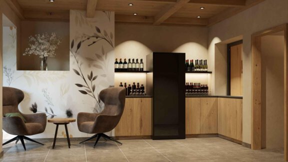 An elegant interior with two comfortable chairs and a wooden counter. In the background, bottles are neatly arranged to create an inviting atmosphere. - Hotel Garni Hainbacherhof - Sölden