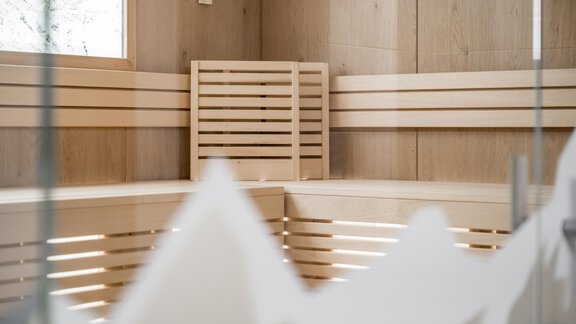 A cozy sauna area made of wood with white accents. The walls are plain and inviting, perfect for relaxing. - Marco's Mountain Home - Sölden