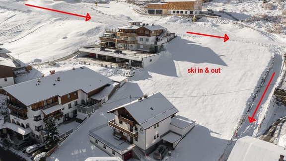 A snowy landscape with several huts and skiing opportunities. The area offers direct access to the ski resort. - Mountain Lodge Sölden - Sölden
