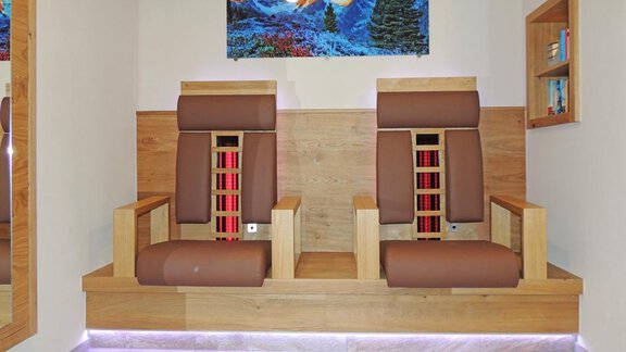 Two comfortable massage chairs are placed in a modern room. The wooden interior is designed to be bright and inviting. - Haus Christophorus - Obergurgl 