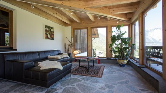 Wintergarten mit Rezeption und Wohnbereich - Ferienhof Haderlehn - Sautens