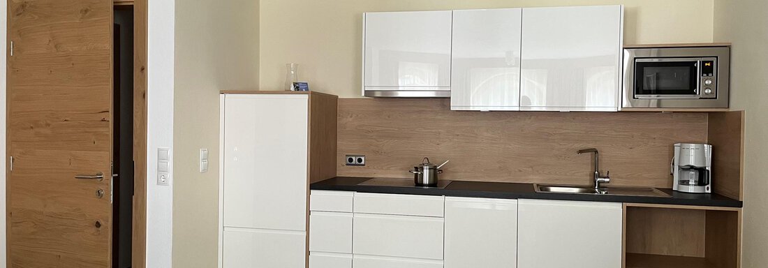 Wohnraum. Küchenzeile. | © Familie Schöpf (CC C) Wohnraum. Küchenzeile. - Appartementhaus Nadine - Gries