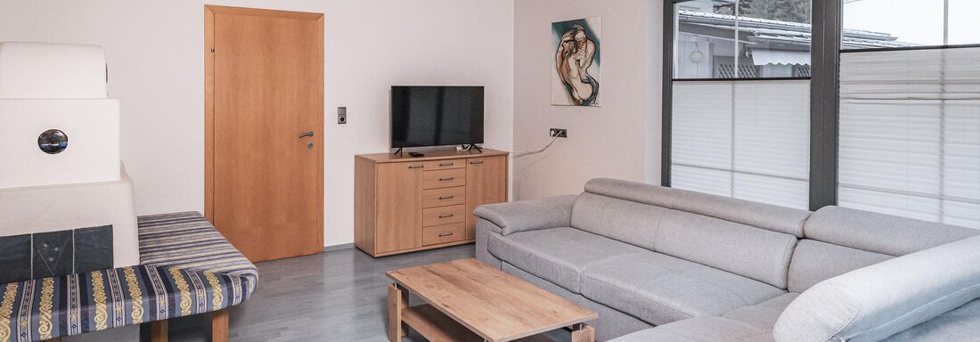 Wohnzimmer mit Kachlofen - APART Naturcamping Kuprian - Huben