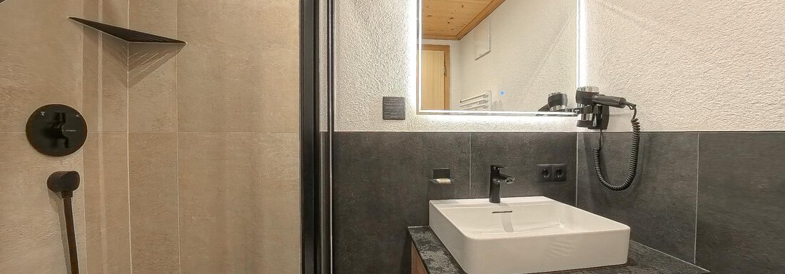 Schlafzimmer Appartement 1 - Appartements Alpenrose - Huben