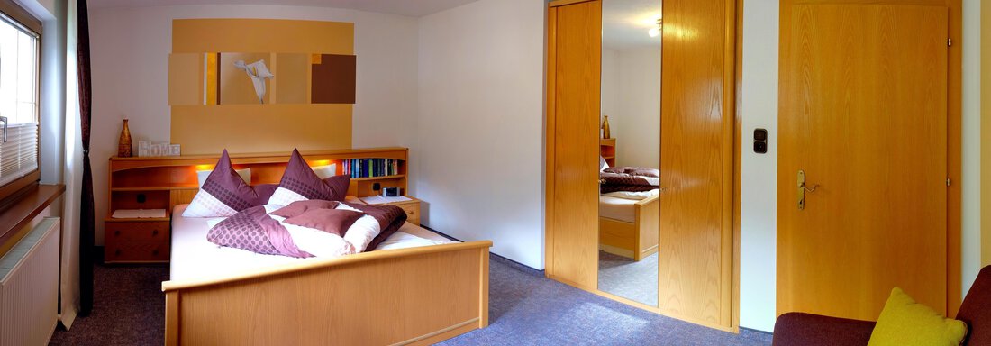 AY Schlafzimmer mit Sofa - Appartements Kuprian - Längenfeld