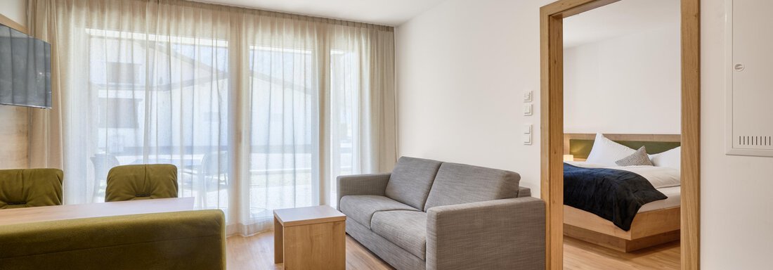 Blick von der Wohnküche ins Doppelzimmer - Das Refugium - Längenfeld