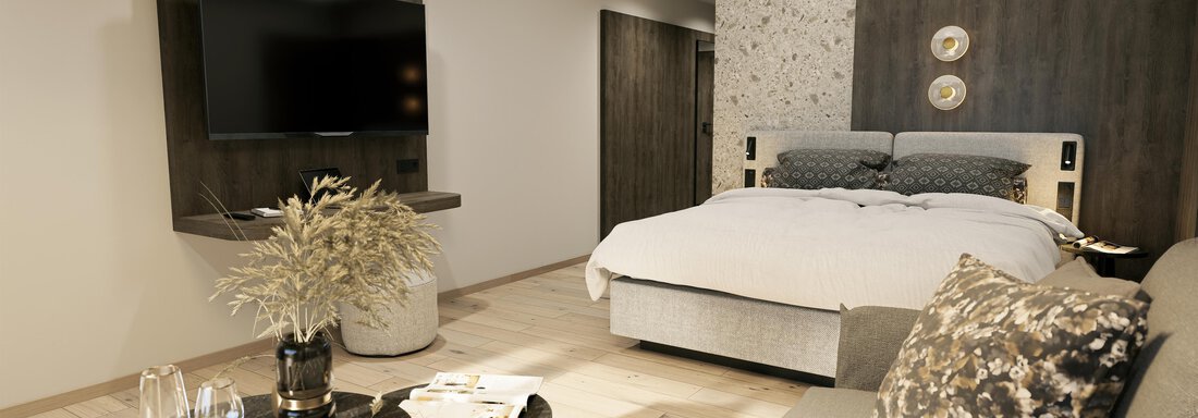 Doppelzimmer Premium A modern bedroom with a cozy bed and a television on the wall. A comfortable seating area with a table and decorations completes the room. - Ferienwohnung de Luxe Alpenresidenz am Mühlbach - Obergurgl