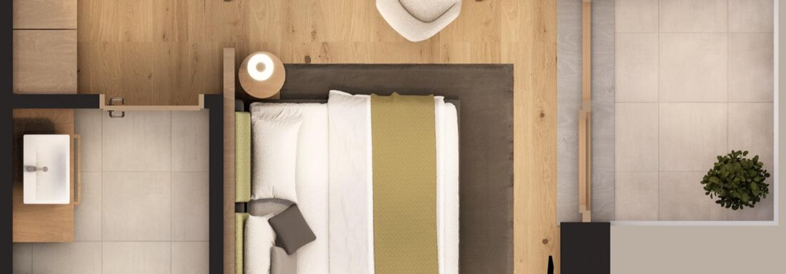 A modern hotel room with a cozy bed and bright wooden surfaces. The room also includes a desk and an armchair. - A CASA "Aventurin" - Sölden