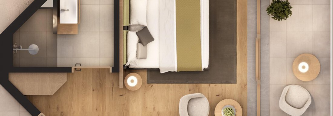 A beautiful hotel room with a large bed, a desk, and comfortable chairs. The room is modernly furnished and has a bright, friendly atmosphere. - A CASA "Aventurin" - Sölden