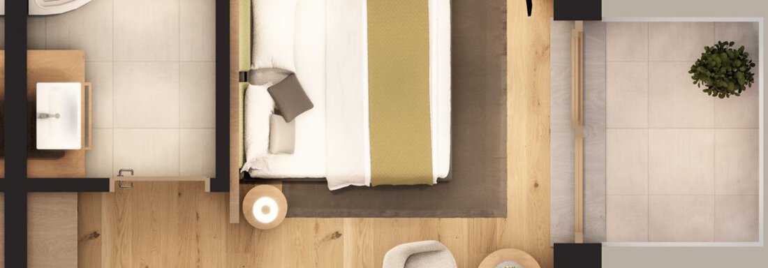 A modern room layout with a bed, a small table, and a sofa. In the bathroom, a toilet and a sink can be seen. - A CASA "Aventurin" - Sölden