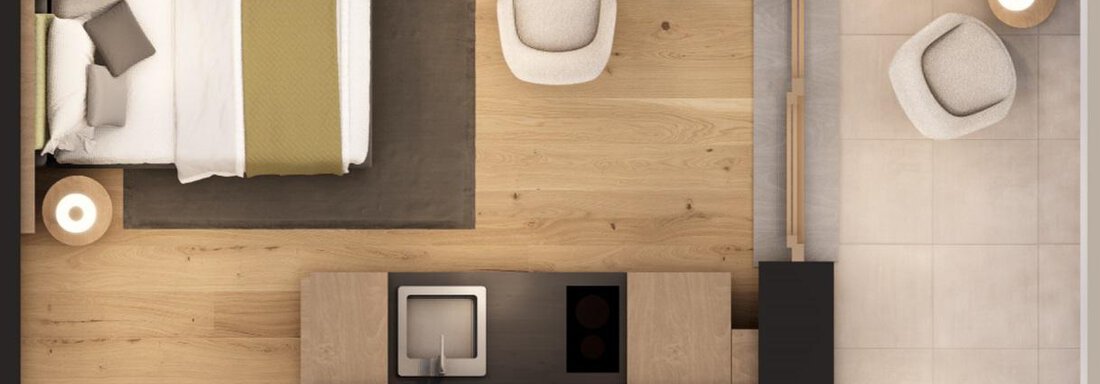 A modern room with a large bed, a cozy seating area, and a spacious bathroom. The floor is made of wood, and the furniture is in neutral colors. - A CASA "Aventurin" - Sölden