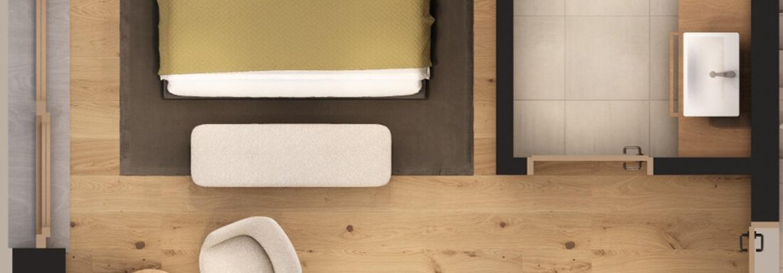 A modern hotel room with a large bed, a cozy armchair, and a small table. The room features a bright wooden floor and a minimalist decor. - A CASA "Aventurin" - Sölden