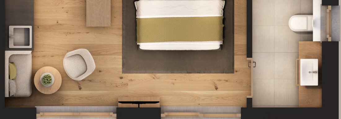 A modern bedroom with a large bed and an elegant design. The room also features a seating area and a small kitchenette. - A CASA "Aventurin" - Sölden