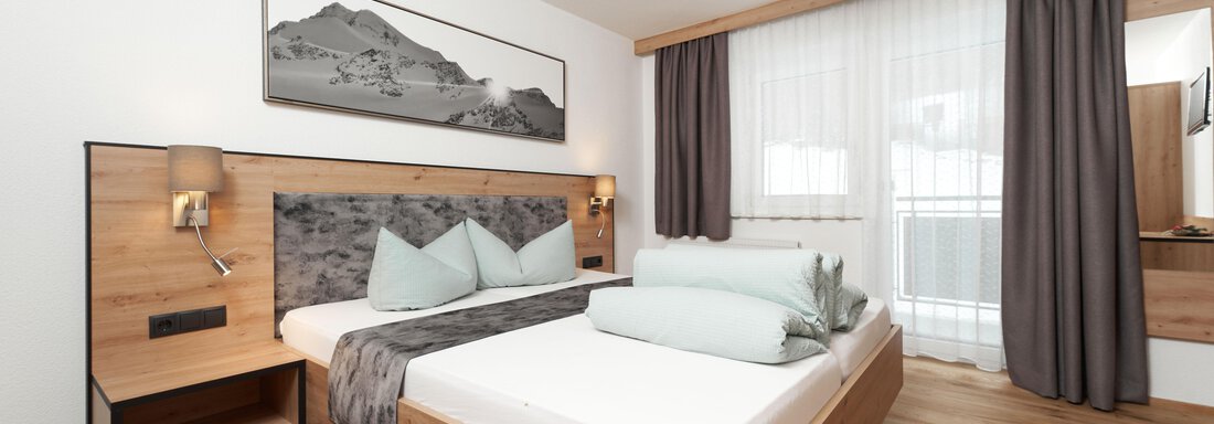 Schlafzimmer - Doppelzimmer mit Balkon Schlafzimmer - Doppelzimmer mit Balkon - Apart Sunnhäusl - Sölden