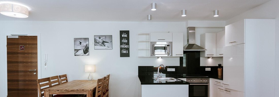 Living/Kitchen_Bergbach Modern kitchen with a dining area. Bright furniture and an inviting, open space concept. - Appartement Bergbach Sölden - Sölden