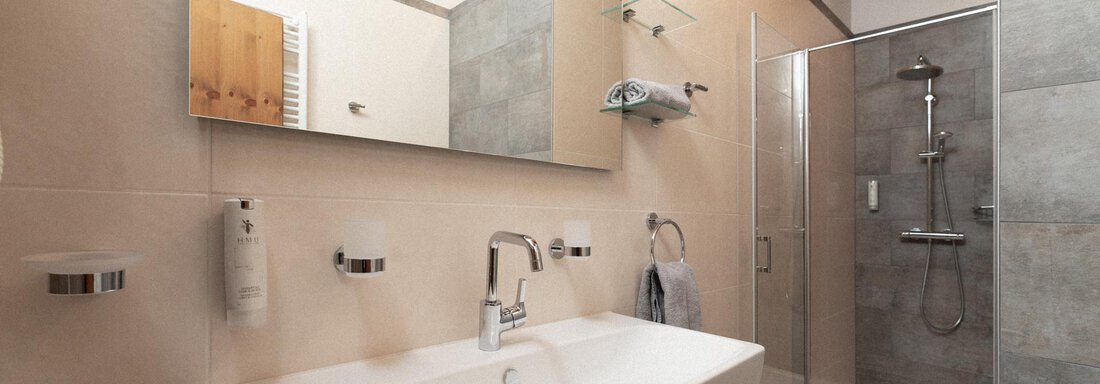 A modern bathroom with a shower and an elegant sink. The walls are light and the room has wood details. - Appartement Gehörde Sölden - Sölden