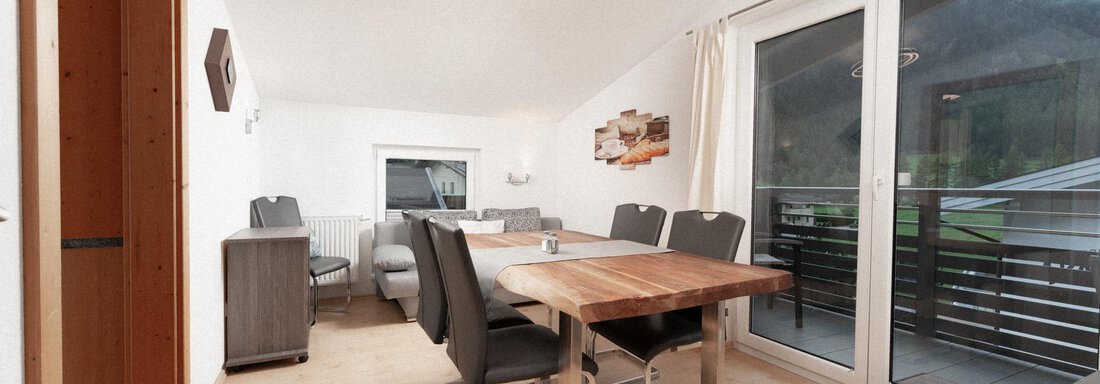 A bright and modern living space with a table and chairs. Large windows provide a view outside. - Ferienhaus F2 - Sölden - Sölden
