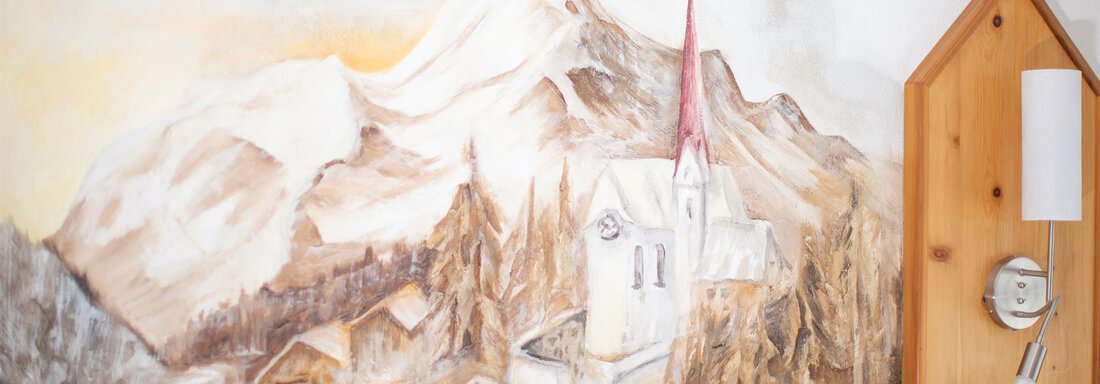 A picturesque mountain landscape with a church and traditional wooden houses. In the background, snow-covered mountains can be seen. - Haus Alpenstern - Sölden