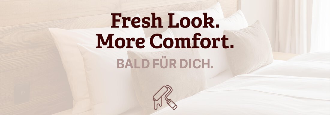 Fresh Look. More Comfort. Bald für dich | © Ötztal Tourismus (CC C) A modern bedroom with a cozy bed and decorative pillows. The text announces a new, comfortable design. - Haus Crystal - Sölden