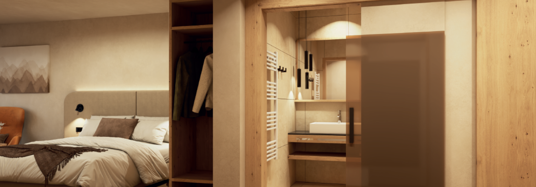 A modern bedroom with a cozy bed and warm wooden details. In the background, there is an elegant bathroom with a sink and stylish elements. - Hotel Garni Hainbacherhof - Sölden